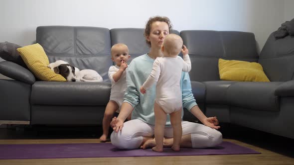 A Mother Trying to Focus and Practice Yoga While Her Twin Babies Keep Bothering Her