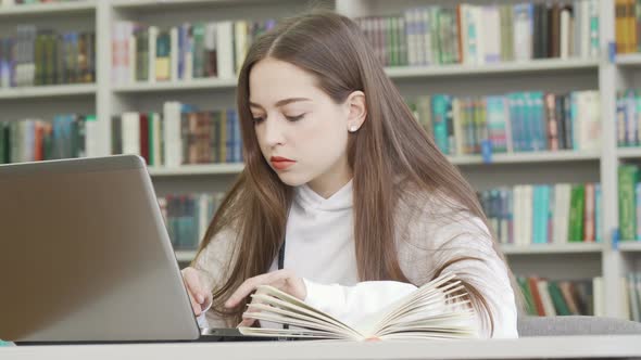 Teenage Girl Using Computer at the Library