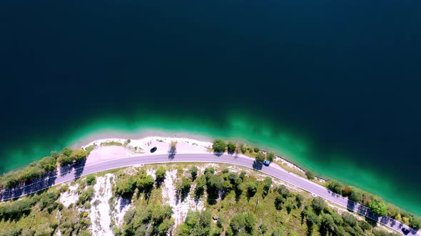 Cars on raod at lakeshore of Plansee lake, Tirol, Austria