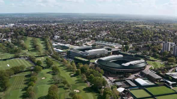 Close up drone shot of Wimbledon Centre court and court 1 stadium