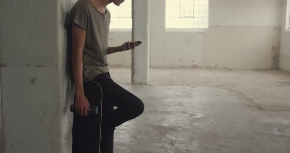 Fashionable young man in an abandoned warehouse