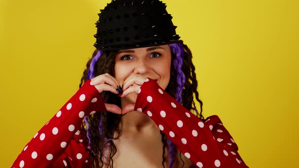 Young Handsome Woman with Dreadlocks Showing Heart with Hands