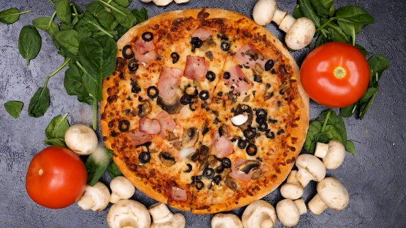 Cutted Mushrooms Falling on Delicious Pizza