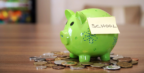 Saving Money for School in Piggy Bank