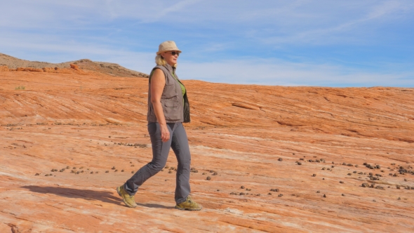 Tourist Hiking in Desert Woman Walking on the Park Red Rock