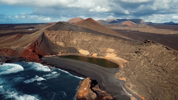 Flying over Volcanic Lake El Golfo near Lanzarote in Canary Islands.