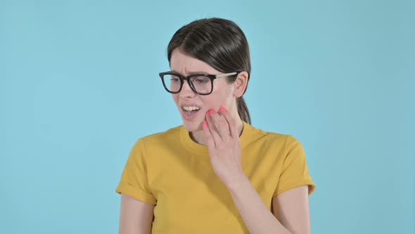 Attractive Young Woman Having Toothache  on Purple Background 