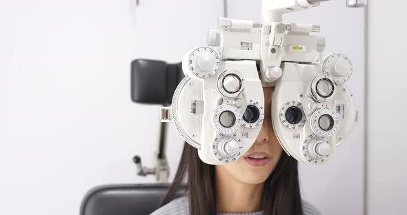 Woman undergo eye exam