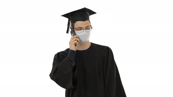 Young Graduate Student Making a Call with Smartphone with Medical Mask on on White Background.