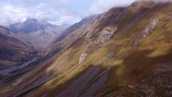 Cloud Shadows On The Autumn Mountain Slope