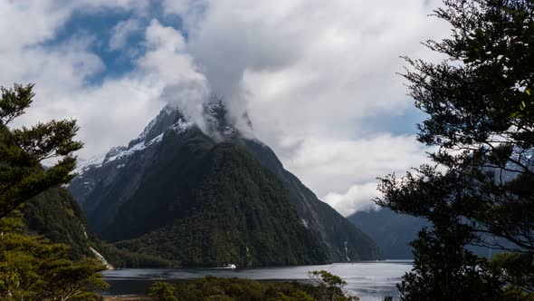 time lapse of clouds swirling around the summit of mitre peak in milford sound