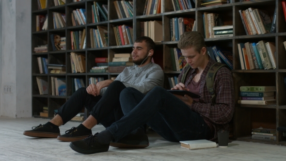Hipster Students Studying in Library at University