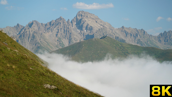 High Rocky Mountains Over the Clouds