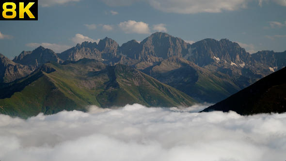 High Rocky Mountains Over the Clouds