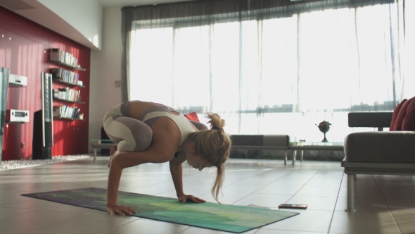 Young Beautiful Sporty Caucasian Girl Exercising Yoga Positions, Asana. Indoors.