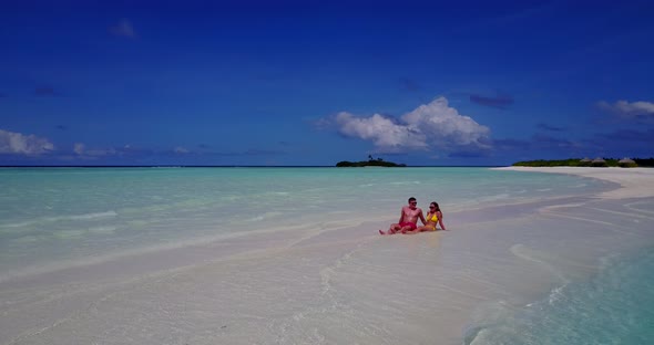 Young man and woman after marriage in love spend quality time on beach on paradise white sand 4K 