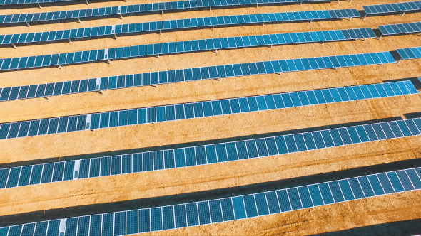 Aerial Reveal of Solar Panels in Field