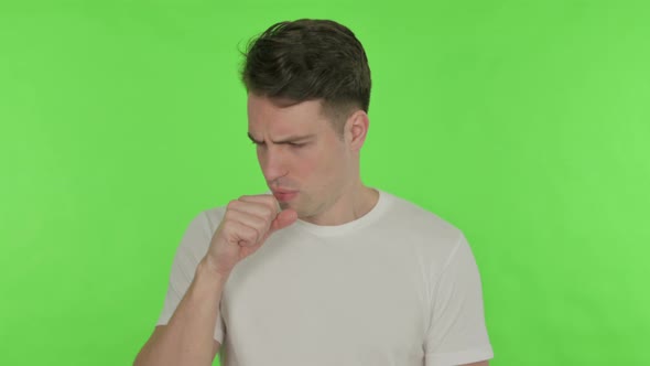 Coughing Young Man Feeling Unwell on Green Background