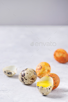 ail eggs with yolk and shell over white texture background. Close up, copy space