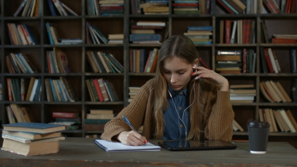 Beautiful Female Student Working Digital Tablet