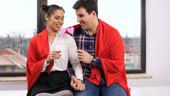 Couple with Red Pepper Heart Playing with Each Other