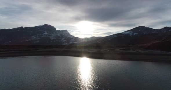 Reflection of the Sun in the Water of a Mountain Lake