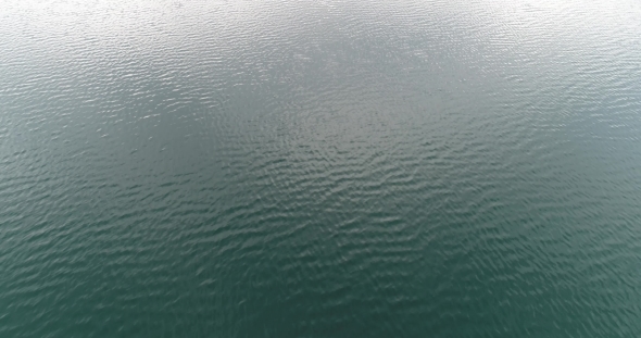 Flying Over the Mountain Lake Water