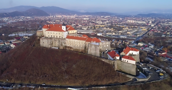 Beautiful Aerial View of Palanok Castle at Sunset and the City of Mukachevo