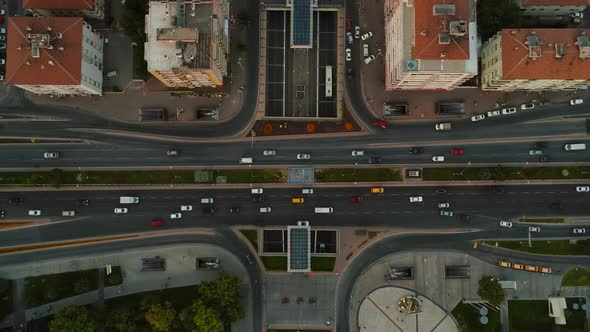 Aerial View Of City In With Cars Driving