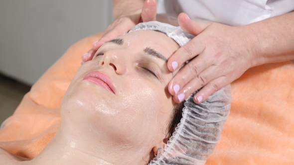 Beauty Concept of Beautician Making Facial Massage Preparing Client Face Skin for Botox Injectio