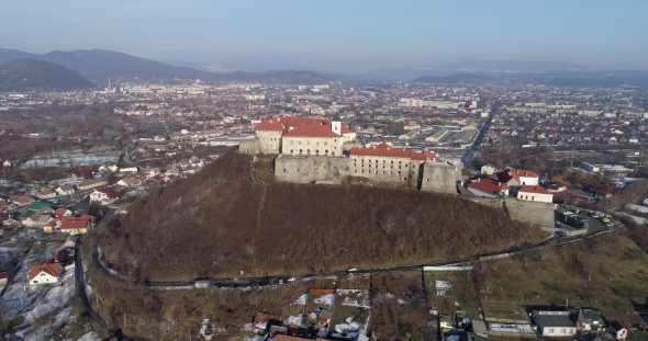 Beautiful Panoramic Aerial View To Palanok Castle at Sunset and the City of Mukachevo