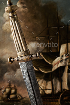 ted background. A closeup view of the handle and the blade design of a Slavic dagger from 19th century.