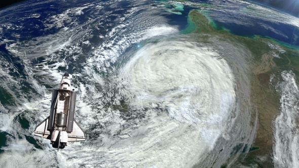 The Space Shuttle Above the Earth and a Hurricane