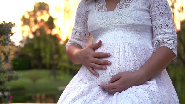 Pregnant Woman Feeling Happy at Garden Home