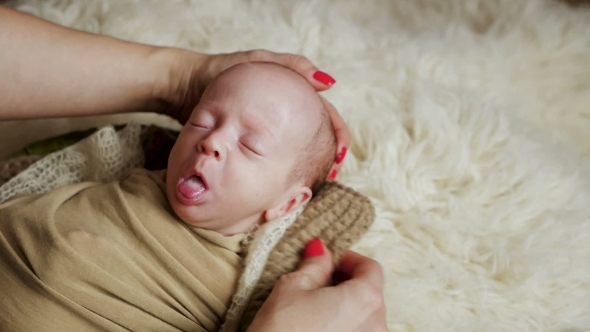 Mother Puts Child To Sleep