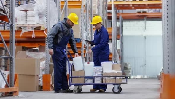 Man and Woman Working in Warehouse