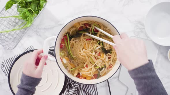 Flat lay. Step by step. Cooking on pot pasta recipe in an enameled cast iron dutch oven.