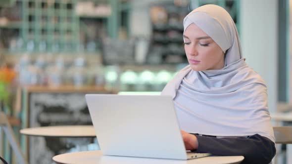 Thumbs Up By Arab Woman Working on Laptop