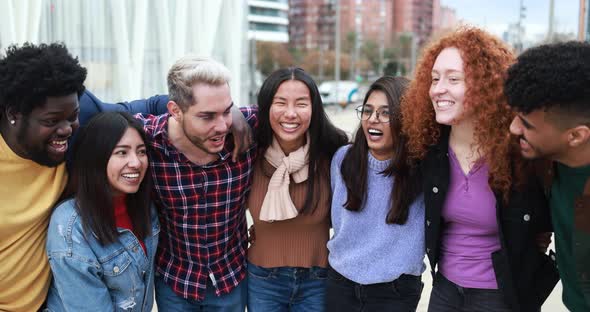 Group of happy multiracial people having fun outdoor laughing together