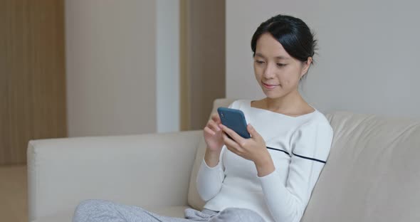 Woman use of smart phone at home