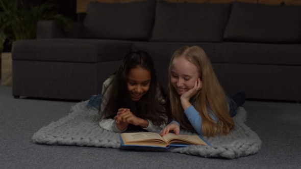 Happy Multiracial Kids Reading Fairytales at Home