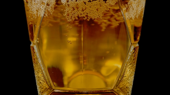 Fresh Beer in a Glass Mug with Bubbles