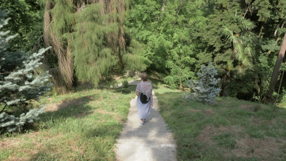 Young Girl Walking in Tropical Botanical Garden. Batumi