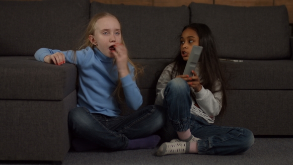 Adorable Diverse Kids Watching TV at Home