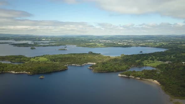 Full sweeping panorama of a series of lakes surrounded by coniferous oaktrees and limestone rock .Fi