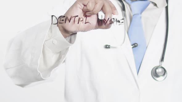 Asian Doctor Writes Dental Hygiene