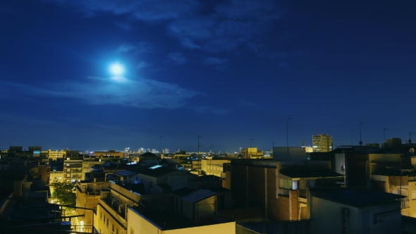 Moonrise Over the City and the Roofs of Houses.  From Evening To Dawn. The Sun Rises Over the City