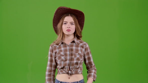 Cowboy Girl Is Showing Her Finger Down. Green Screen