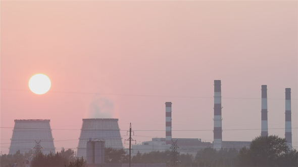 Sunset over the Thermal Power Plant in the Smog