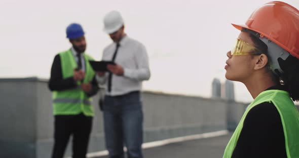 On Construction Site Thinking Young African Woman